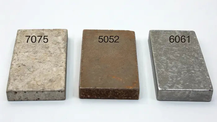 A comparison table or infographic showing ratings for strength, corrosion, and machinability for different alloys.