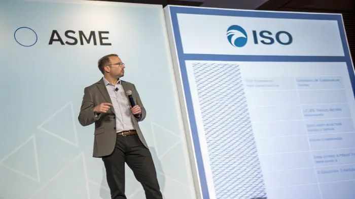 A world map highlighting North America for ASME and the rest of the world for ISO